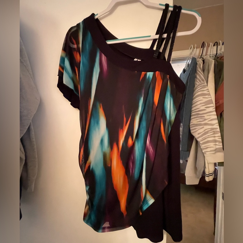 Super cute top with black sequin straps on one shoulder Perfect with leggings